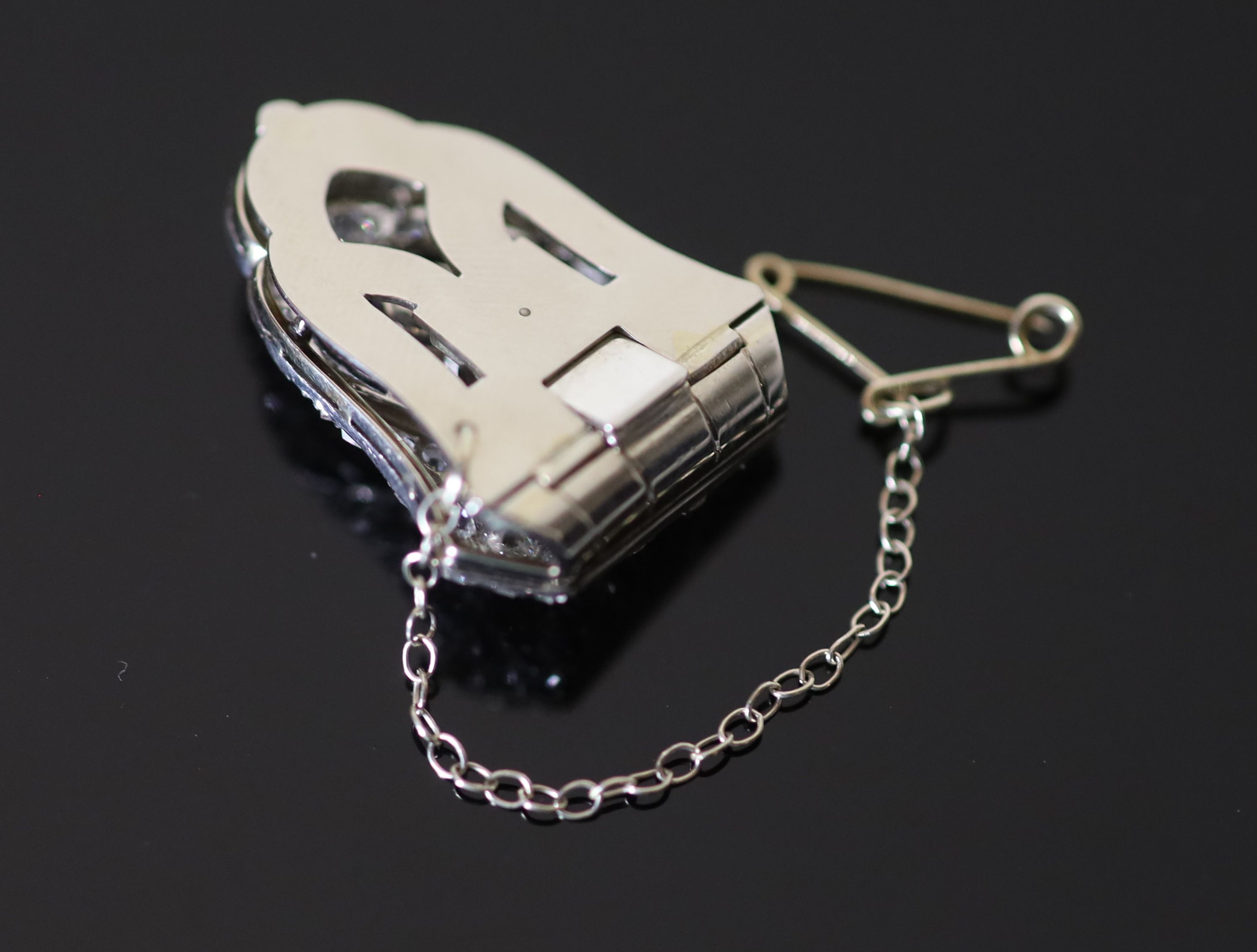 An Art Deco white gold old and rose cut diamond cluster set dress clip, with safety chain, in original Koch of Frankfurt box,